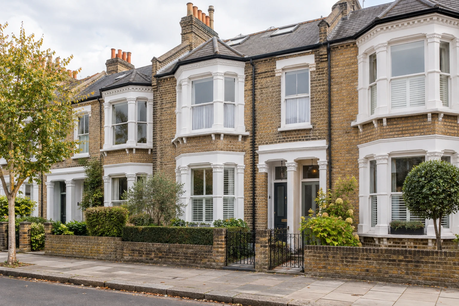 Victorian terraced houses in London with brick façades and bay windows